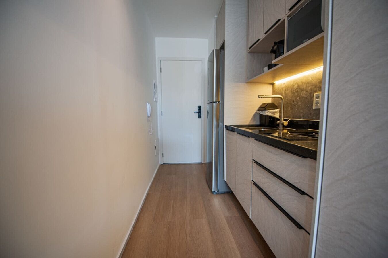 Full-size fridge, microwave, stovetop, cookware/dishes/utensils