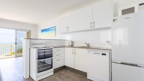 Fridge, microwave, oven, stovetop - Scorpio Unit 3 is a relaxed waterfront holiday apartment in the heart of Yamba (Yamba)