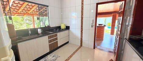 Coffee/tea maker, fridge, cookware/dishes/utensils