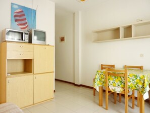 Apartment, 1 Bedroom, Balcony, Garden View | Dining room - Cozy Beachside Apartment With Balcony (San Michele al Tagliamento)
