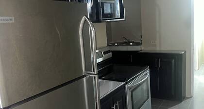 Lovely 6-bedroom building with AC in peaceful Kingston