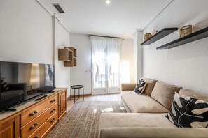 Deluxe Apartment, City View | Living area | Flat-screen TV - ARCO Gran Via Boutique Apartments (Madrid)