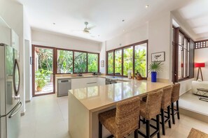 Fridge, microwave, oven, stovetop - Three Dolphins Villa · Private Pool · Family Stay (Puerto Aventuras)