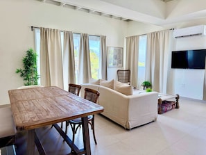 TV, offices - Renovated Beachside 3BR | Balcony & Pool (San Juan)