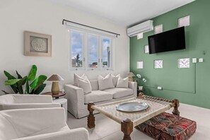 TV, offices - Beachside Boho Apartment with Pool (San Juan)