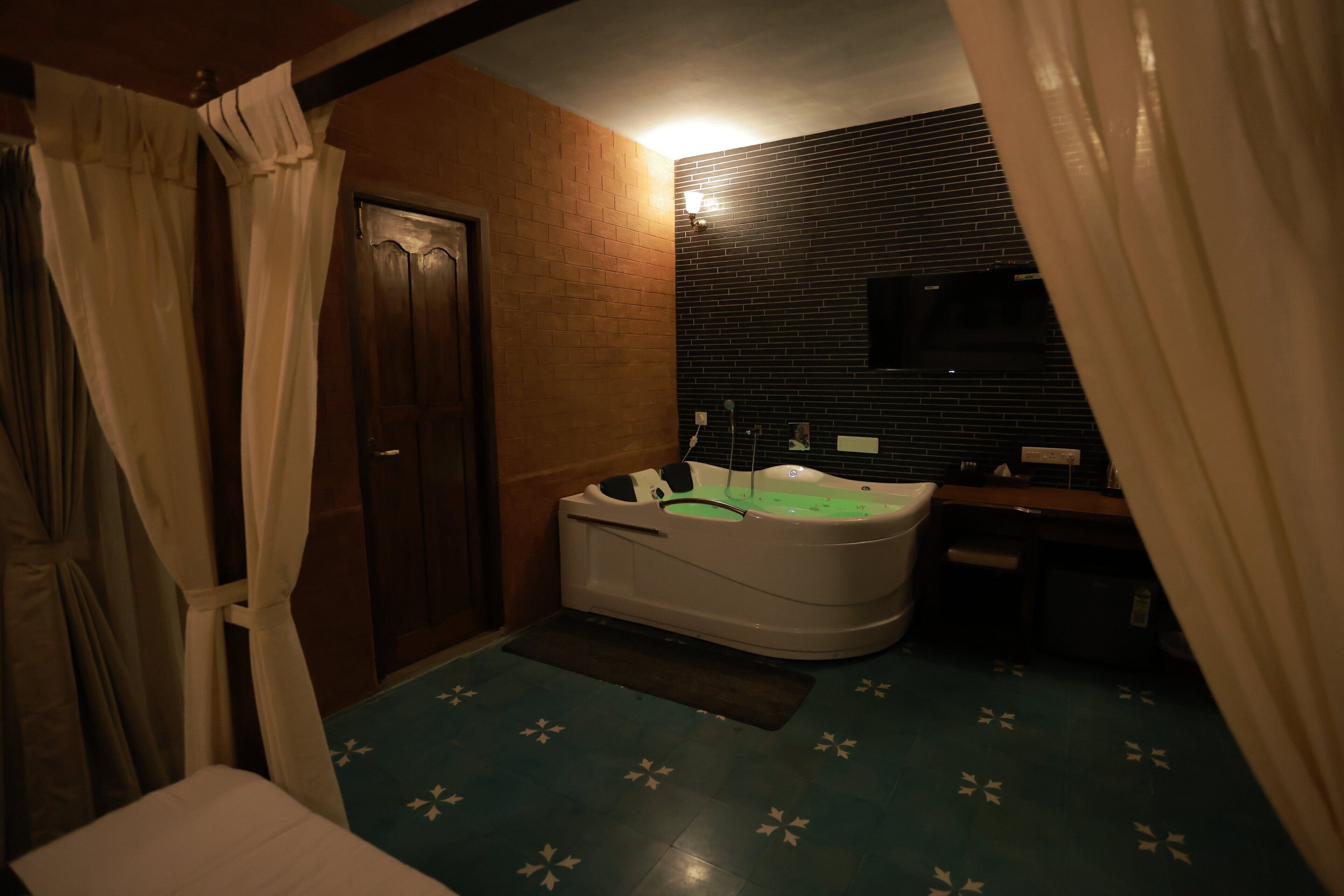 A bathroom with a bathtub, a shower, and a sink.