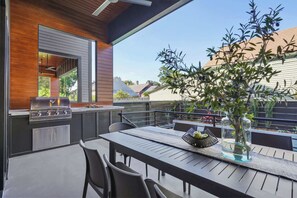 Outdoor dining - Bywater Retreat | Heated Pool + Roof Deck (New Orleans)