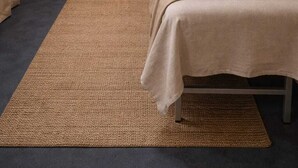 A serene spa room with a meditation area, a massage bed, and a large Buddha statue. - Private rooms in the city center (Buenos Aires)