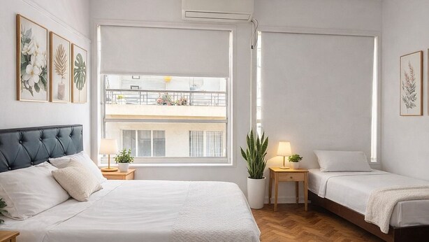 A modern bedroom with a large bed, two bedside tables, a floor lamp, and a view of a balcony. - Private rooms in the city center (Buenos Aires)
