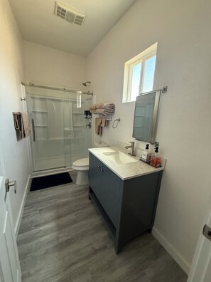 Shower, hair dryer, towels, soap