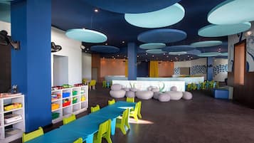 A children's play area with colorful furniture and storage units.