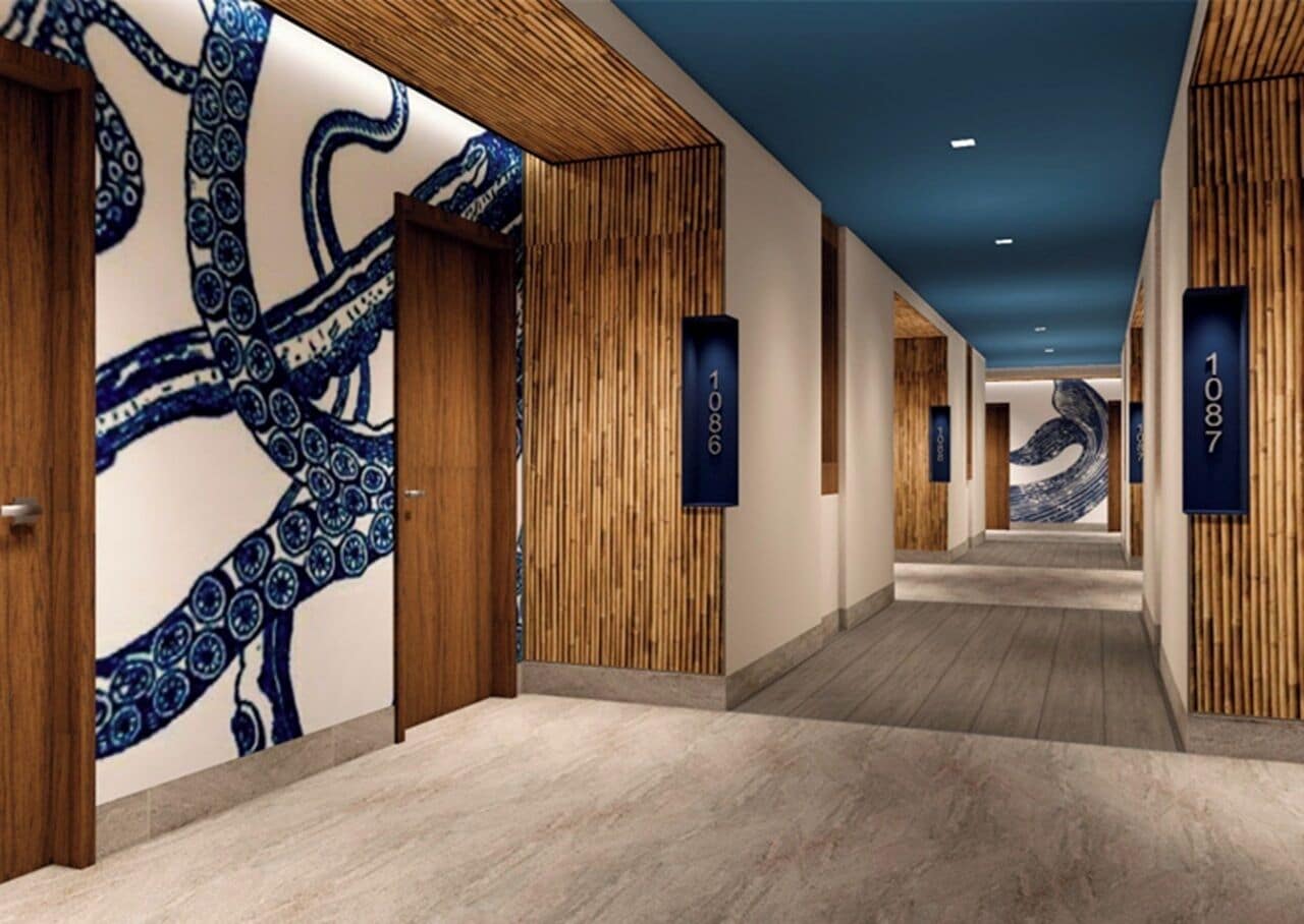 A hallway with wooden paneling, a blue octopus mural, and numbered signs.