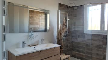 Shower, towels, soap, toilet paper