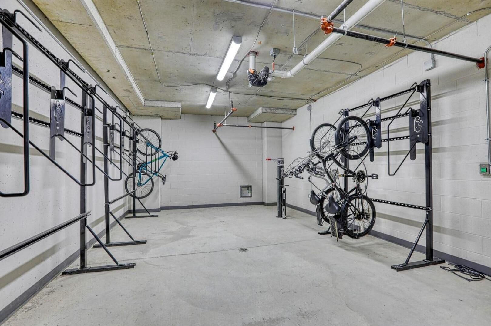 A bike storage area with multiple racks for bicycles.