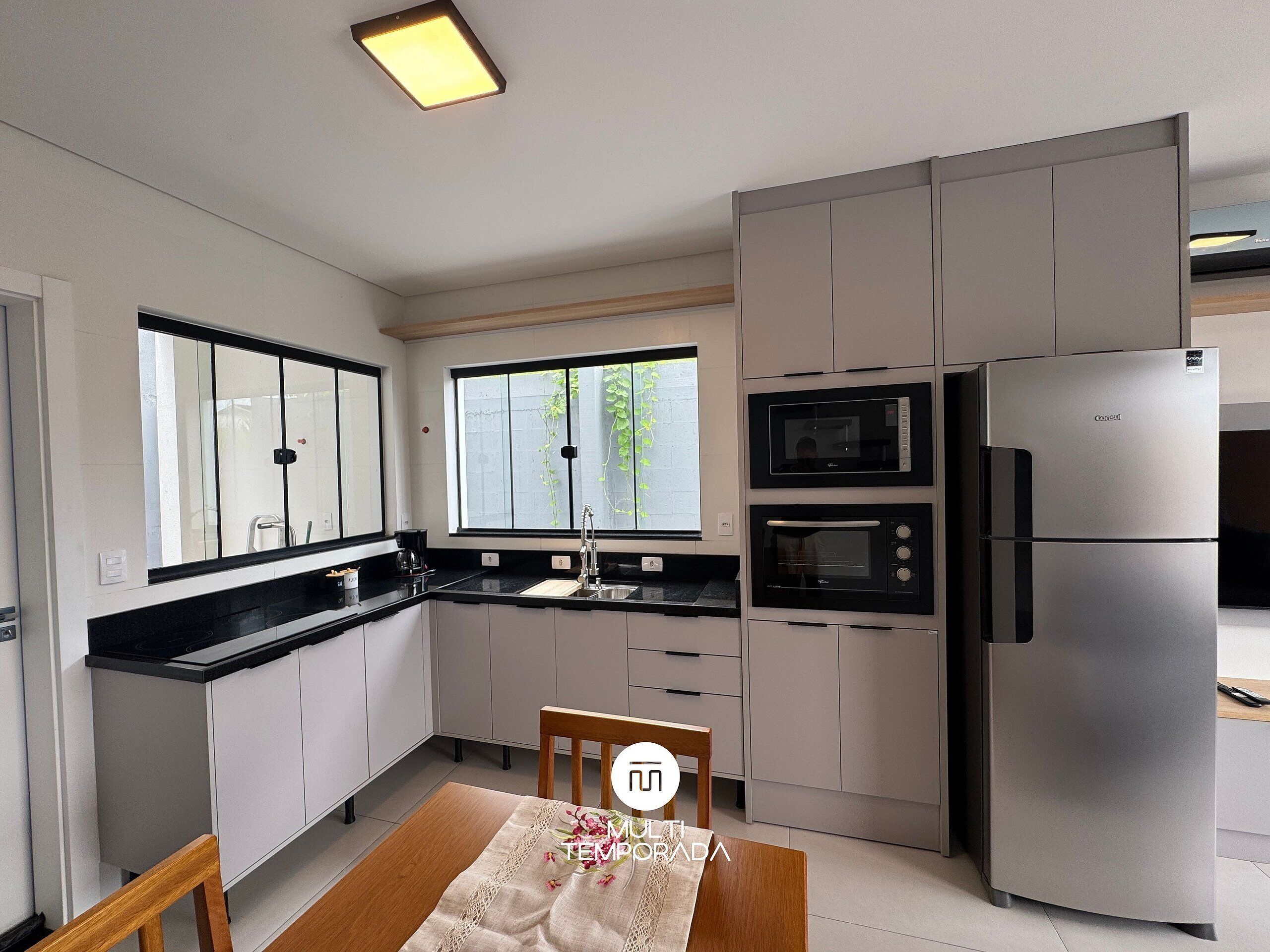 Premium House | Private kitchen | Fridge, microwave, cookware/dishes/utensils, dining tables