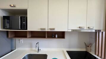 Deluxe Apartment, Balcony | Private kitchen | Microwave, oven, cookware/dishes/utensils