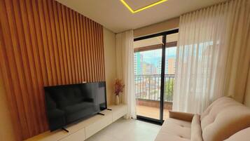 Departamento Confort | Área de sala de estar | Televisión