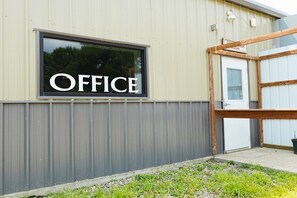 A building with a sign that reads 'OFFICE' on the facade. - Homestead Motel & RV (Sloan)