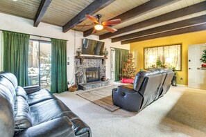 TV, fireplace, books