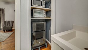 A compact kitchenette with a microwave, toaster oven, and a refrigerator. - Sip, Hike & Explore: Quiet SoCal Studio w/ Patio! (Winchester)