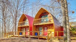 A cabin with a red roof and wooden exterior, featuring a balcony and a porch with steps. - 1 Mi to TIEC: Peaceful Mountain Cabin (Mill Spring)