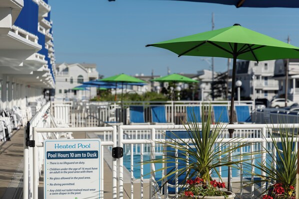 Seasonal outdoor pool, pool umbrellas, sun loungers - Concord Suites (Avalon)