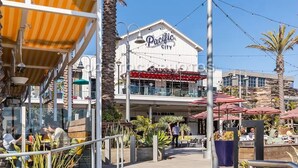 A building with a sign reading "Pacific City."