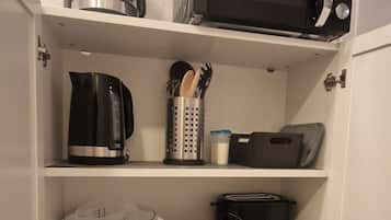 Fridge, microwave, stovetop, coffee/tea maker