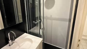 Shower, hair dryer, towels, toilet paper