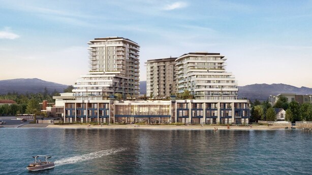 Un hotel frente al agua con arquitectura moderna, que cuenta con varios balcones y fachada de vidrio.