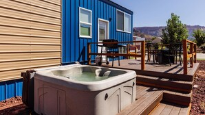 A hot tub on a wooden deck with a view of mountains. - Zion Tiny Home • Hot Tub •  Gooseberry Mesa Trails (Apple Valley)