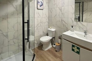 Shower, hair dryer, towels, soap
