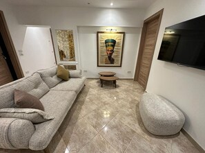 TV - Elegant 2BR Heliopolis Suite | Private Garden Terrace & A/C (Heliopolis)