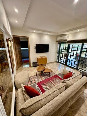 TV - Elegant 2BR Heliopolis Suite | Private Garden Terrace & A/C (Heliopolis)
