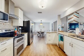 Fridge, microwave, oven, stovetop - Quiet, private retreat with lake views, huge covered deck, W/D, & fenced yard (Canyon Lake)