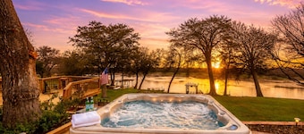 Idyllic waterfront getaway with private hot tub & deck views - near golf