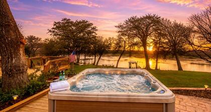Idyllic waterfront getaway with private hot tub & deck views - near golf