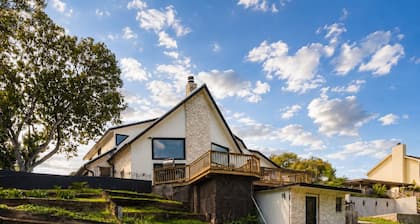 Idyllic waterfront getaway with private hot tub & deck views - near golf