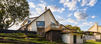 Idyllic waterfront getaway with private hot tub & deck views - near golf