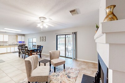Dog-friendly home with huge yard, covered patio, & fireplace