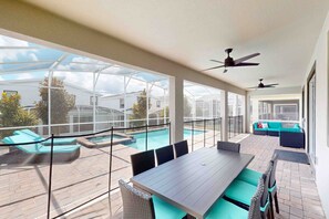 Outdoor dining - Luxury resort home with themed rooms, air hockey, pool table, pool and spa (Kissimmee)