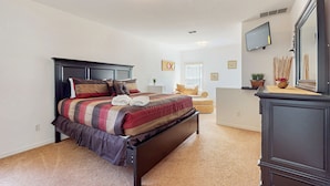 A bedroom with a bed, a dresser, a television, and a window. - Spacious home in cute area with central AC & washer/dryer - snowbirds welcome (Davenport)