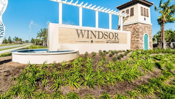 A sign for 'Windsor at the Oasis' with a pool and a pergola. - Fun, dog-friendly home with private pool, high-speed WiFi, W/D, & game rooms (Kissimmee)