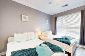 A hotel room with two beds, a large window with blinds, and two wall-mounted artworks. - Dog-friendly condo with balcony, pool, W/D, fast WiFi, gym, children's pool, AC (Kissimmee)