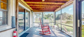 Lakefront home with water views, foosball, screened porch, & private W/D