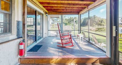 Lakefront home with water views, foosball, screened porch, & private W/D