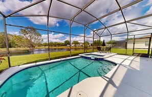 A heated pool - Water view retreat with lanai, heated pool, pool spa, game room, & AC (Kissimmee)