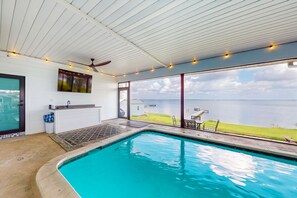 Indoor pool, a heated pool - Renovated lakefront retreat with screened pool, private dock, patio, grill & W/D (Lake Placid)