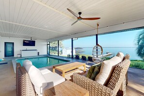 Indoor pool, a heated pool - Renovated lakefront retreat with screened pool, private dock, patio, grill & W/D (Lake Placid)