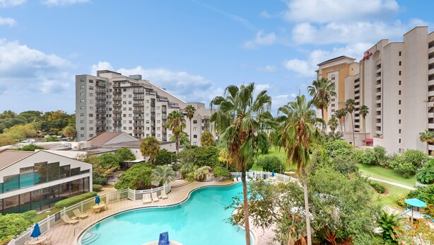 Indoor pool, a heated pool - Spacious Condo with a Kitchen, AC, Pools, Hot Tubs, Tennis, & Gym (Orlando)